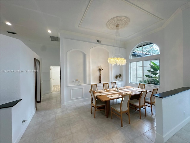 dining space with crown molding