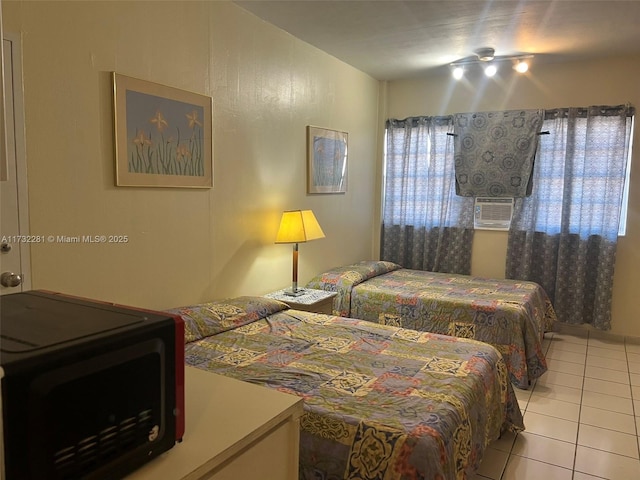 bedroom featuring light tile patterned floors