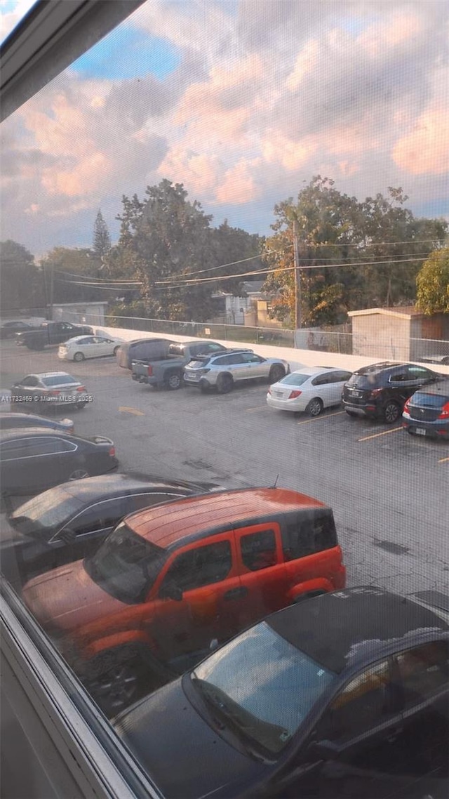 view of parking at dusk