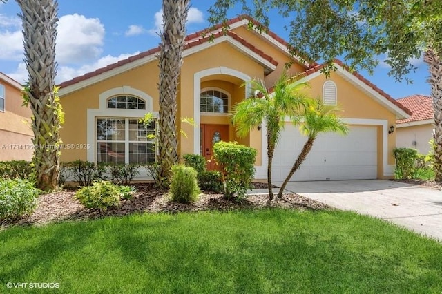 mediterranean / spanish-style home featuring stucco siding, a front lawn, concrete driveway, an attached garage, and a tiled roof