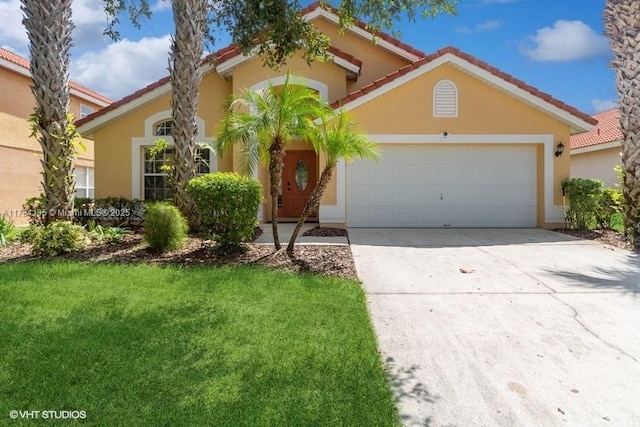 mediterranean / spanish-style house with stucco siding, concrete driveway, and a tiled roof