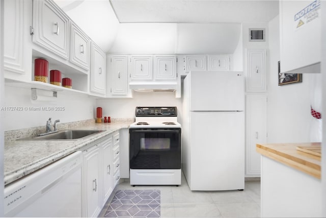 kitchen with range hood, sink, white cabinets, light tile patterned floors, and white appliances