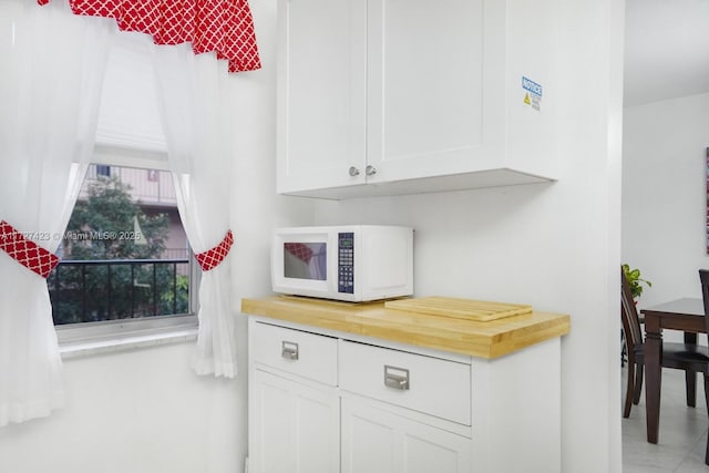 kitchen featuring white cabinets