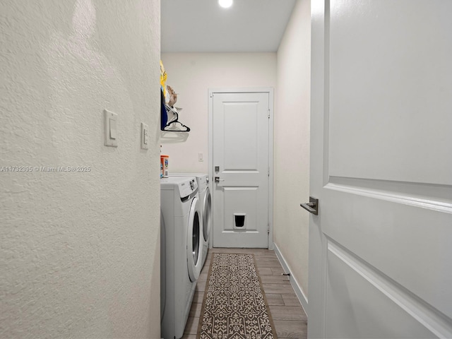 laundry room featuring washing machine and clothes dryer