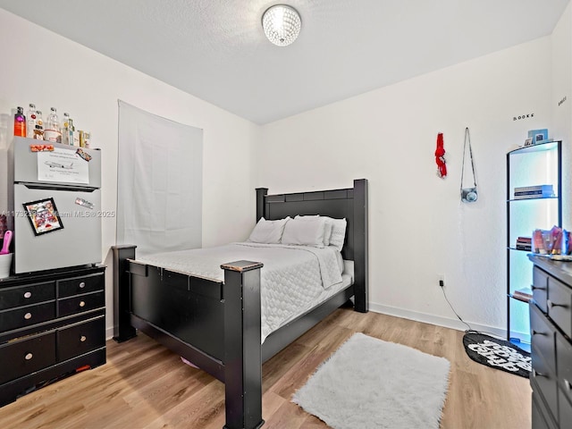 bedroom featuring light wood-type flooring