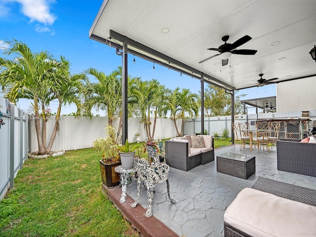 view of patio featuring outdoor lounge area and ceiling fan