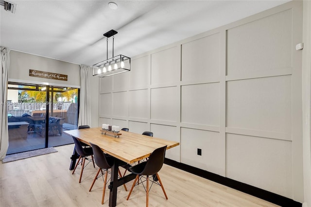 dining area with light hardwood / wood-style flooring