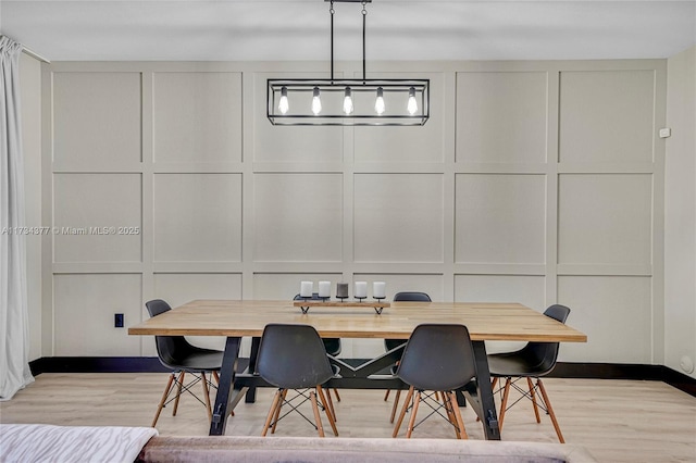 dining space featuring light hardwood / wood-style floors