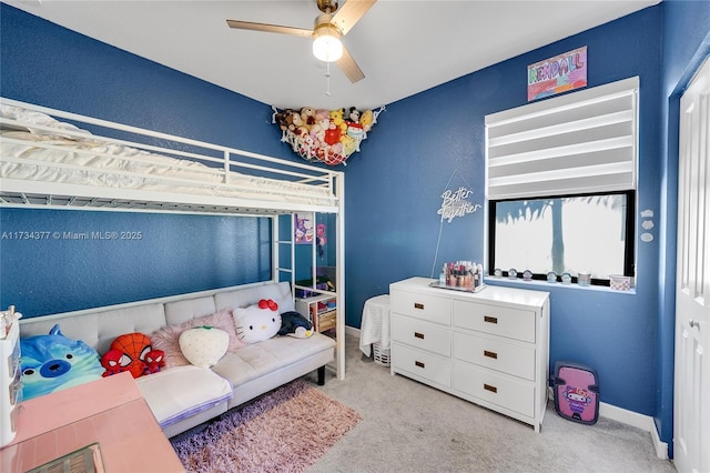 carpeted bedroom with ceiling fan