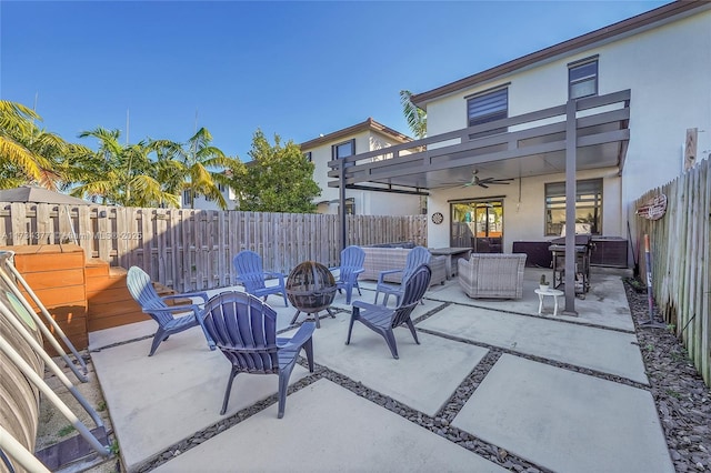 view of patio with grilling area, an outdoor living space with a fire pit, and ceiling fan