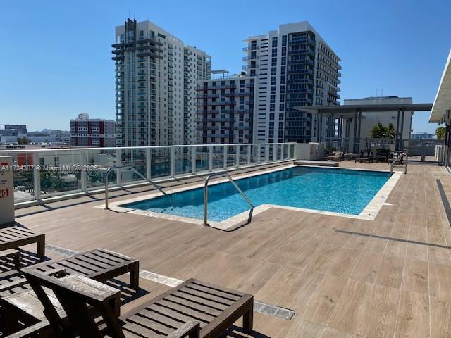 view of swimming pool with a patio area