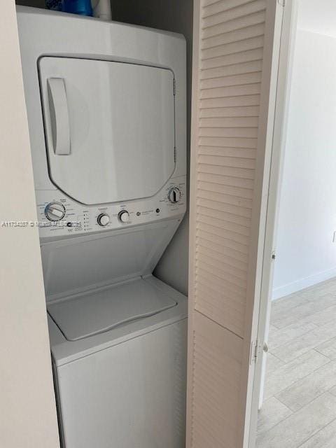 laundry area featuring stacked washer and dryer