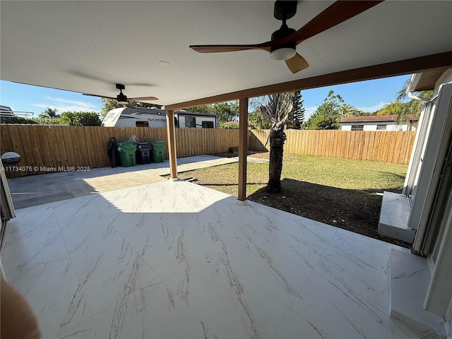 view of patio featuring ceiling fan