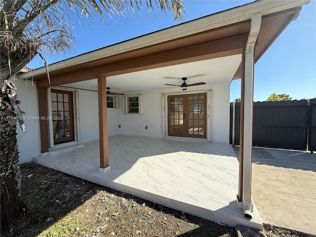 view of patio / terrace with ceiling fan and french doors