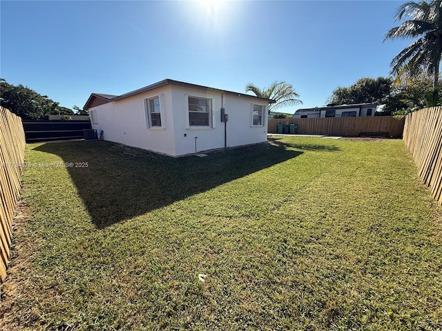 view of yard with central AC