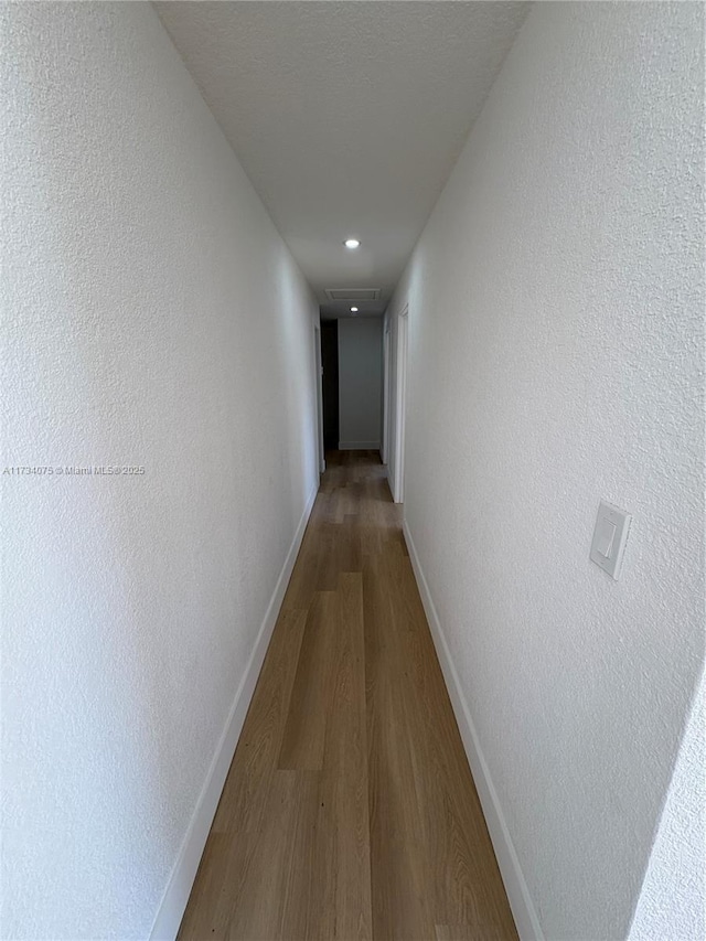 corridor featuring hardwood / wood-style flooring