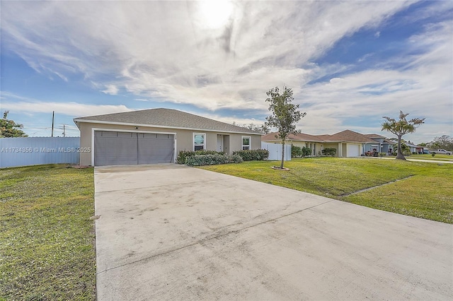 single story home featuring a garage and a front lawn