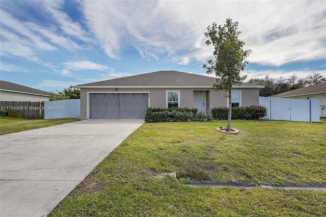 ranch-style home featuring a garage and a front yard