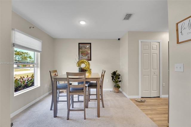 view of carpeted dining area