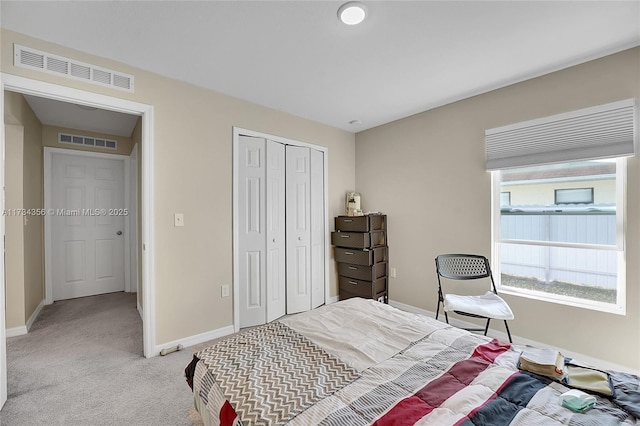 carpeted bedroom with a closet