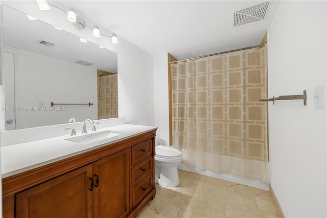 full bathroom featuring vanity, shower / tub combo, and toilet