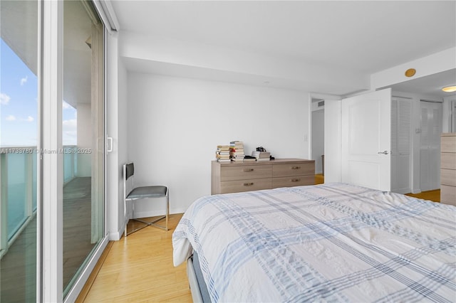 bedroom featuring light wood-type flooring