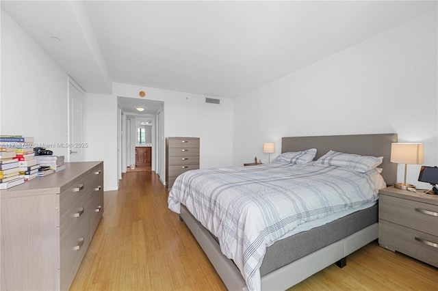 bedroom with light wood-type flooring