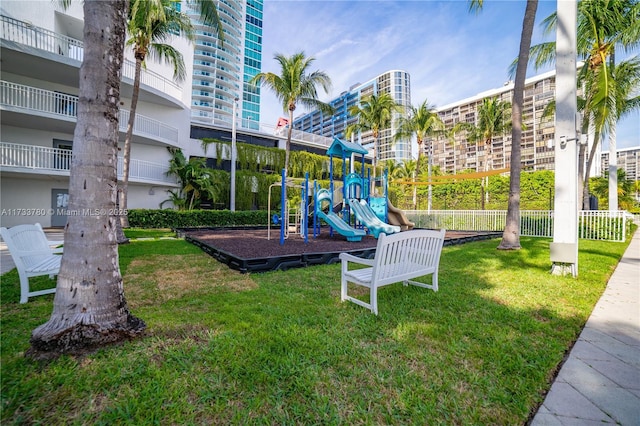 view of playground with a yard