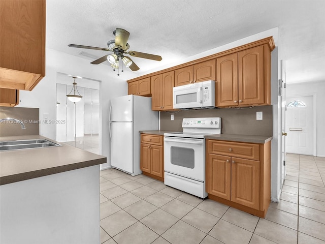 kitchen featuring sink, white appliances, ceiling fan, and light tile patterned flooring