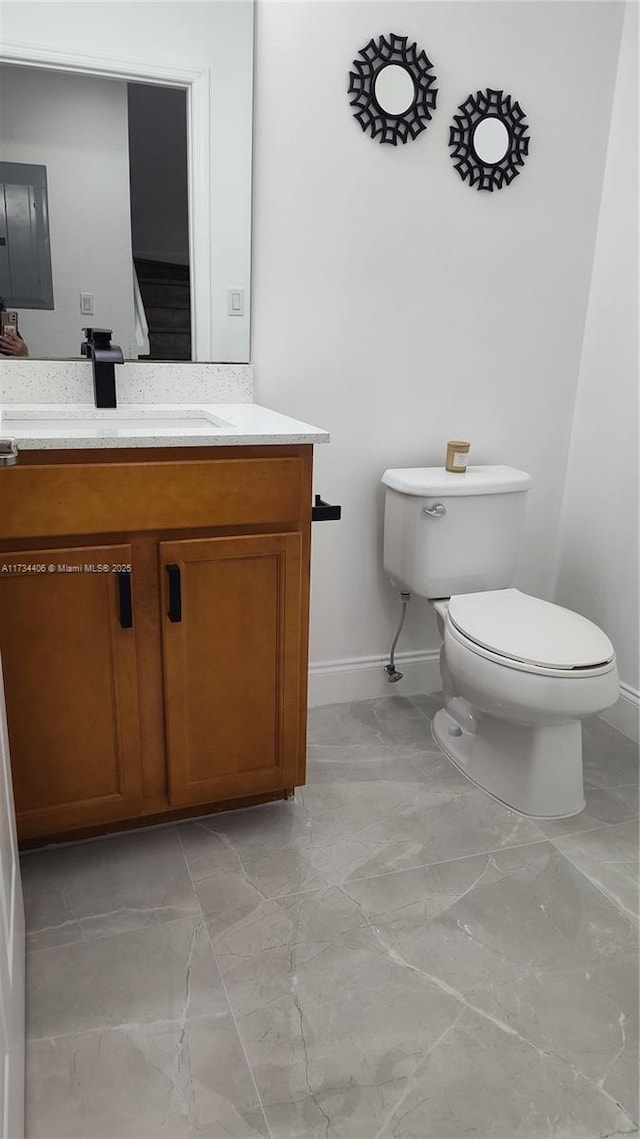 bathroom featuring vanity and toilet