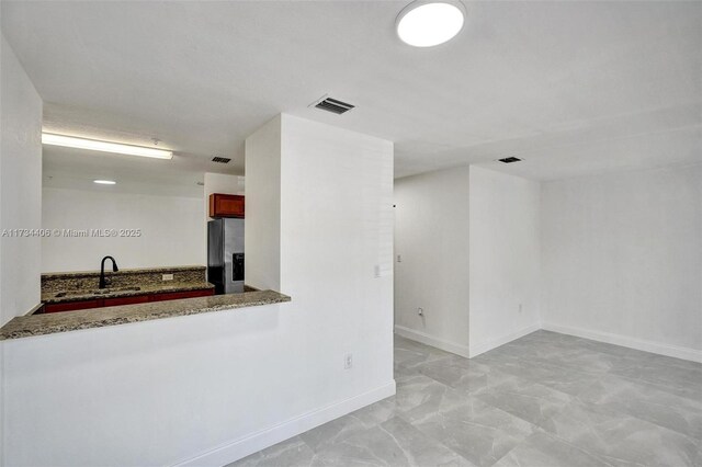 hallway with dark hardwood / wood-style flooring