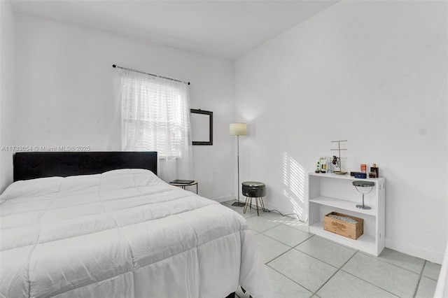 bedroom with light tile patterned floors