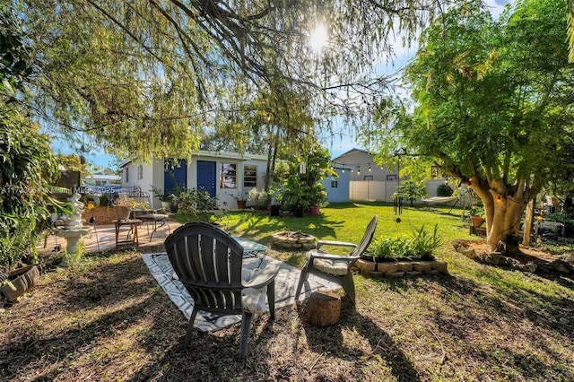 view of yard with an outdoor fire pit