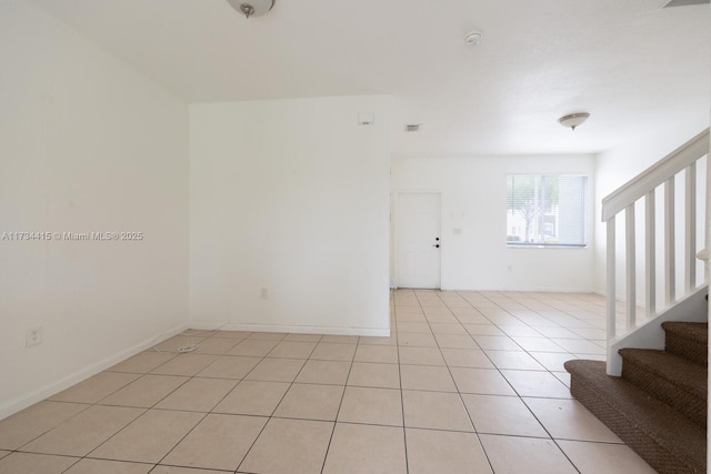2818 SE 16th Ave Unit 118, Homestead, FL 33035 - unfurnished room with stairs, light tile patterned flooring, and a smoke detector