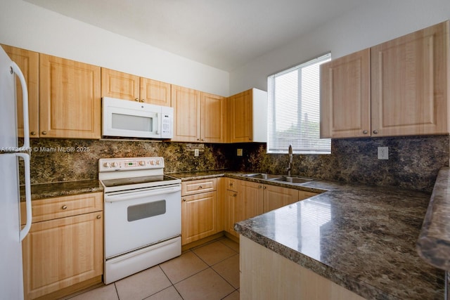2818 SE 16th Ave Unit 118, Homestead, FL 33035 - kitchen with white appliances, dark countertops, light brown cabinetry, and backsplash