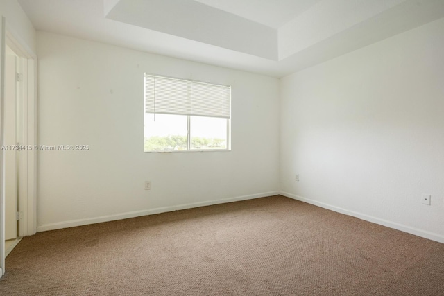 2818 SE 16th Ave Unit 118, Homestead, FL 33035 - carpeted spare room with baseboards and a raised ceiling