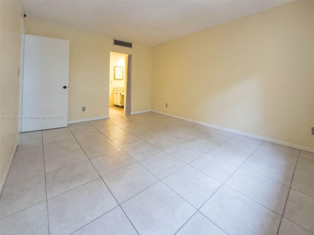 spare room with light tile patterned floors