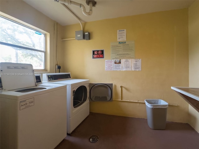 washroom with washer and dryer