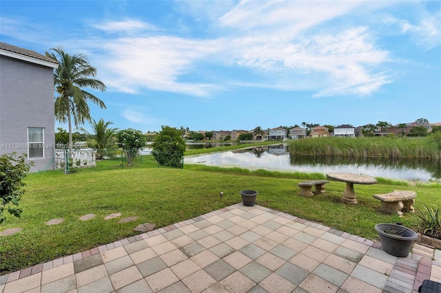 view of patio featuring a water view