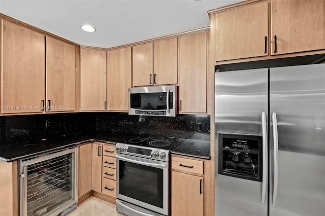 kitchen featuring wine cooler, light brown cabinets, dark stone counters, stainless steel appliances, and decorative backsplash