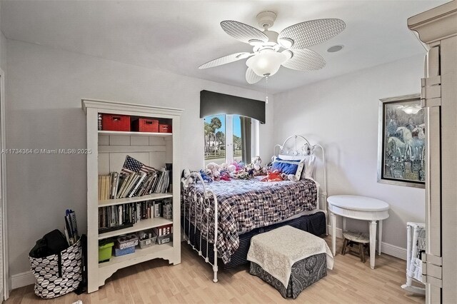 bedroom with ceiling fan and hardwood / wood-style floors