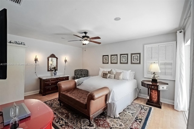 bedroom featuring light hardwood / wood-style floors and ceiling fan