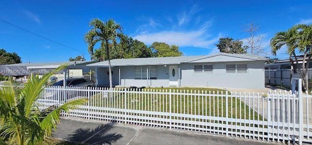 single story home with a carport and a front yard