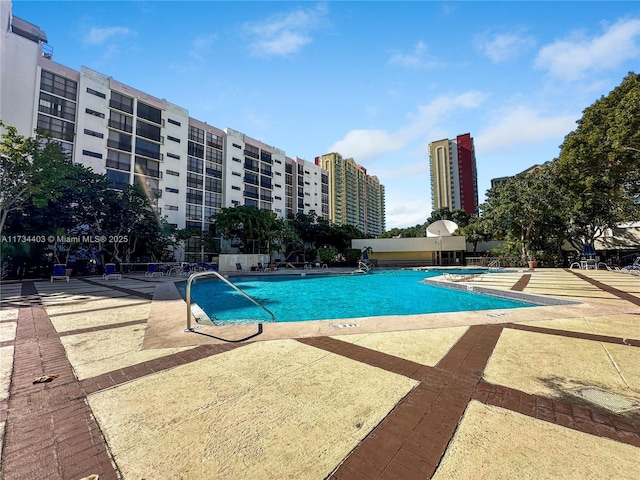 view of swimming pool with a patio area