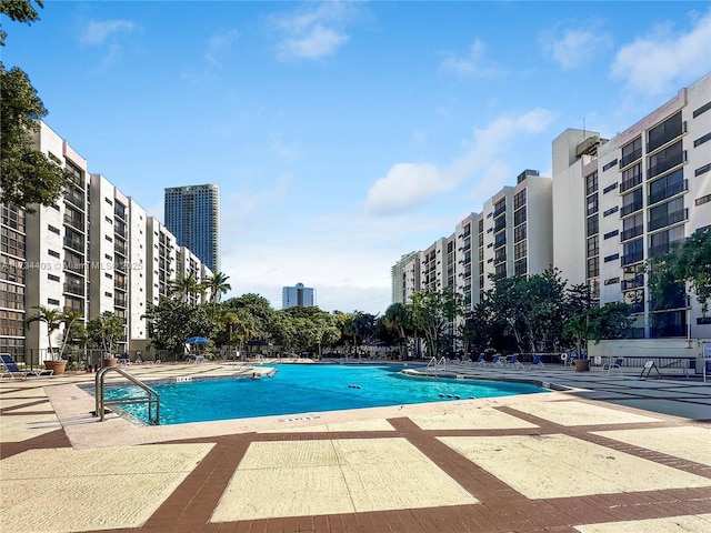 view of swimming pool featuring a patio area