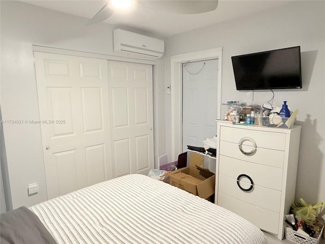 bedroom featuring ceiling fan and an AC wall unit