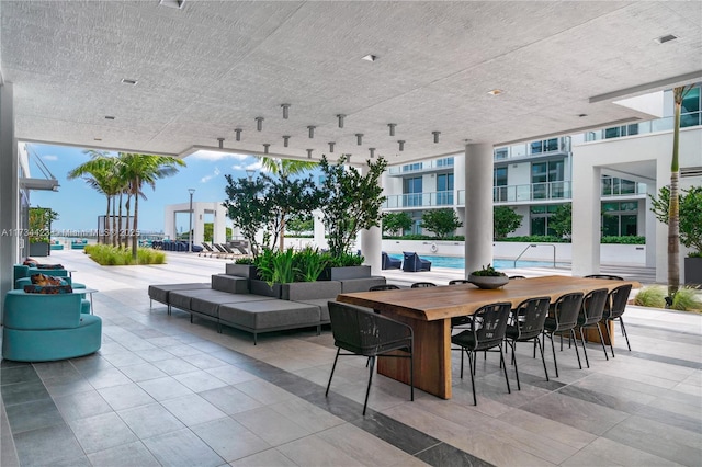 view of patio / terrace with a community pool and an outdoor hangout area