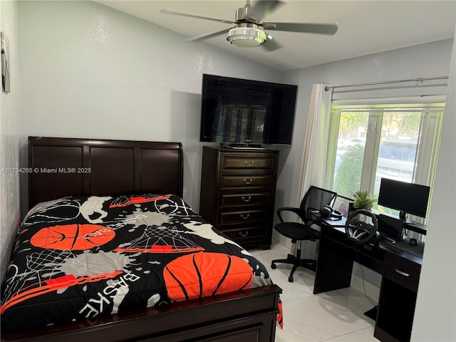 bedroom with a ceiling fan and vaulted ceiling