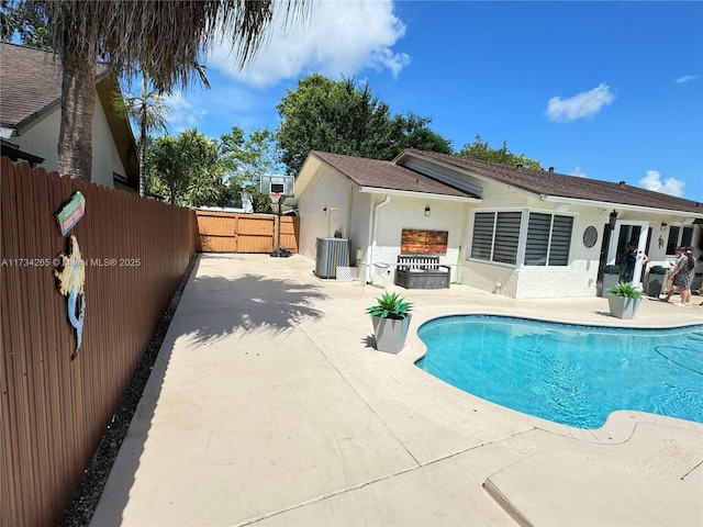 view of pool featuring a fenced in pool, a patio area, and fence