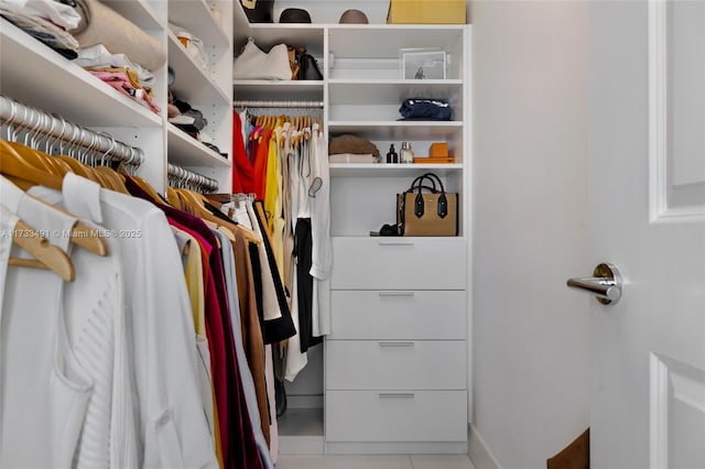 walk in closet featuring tile patterned flooring